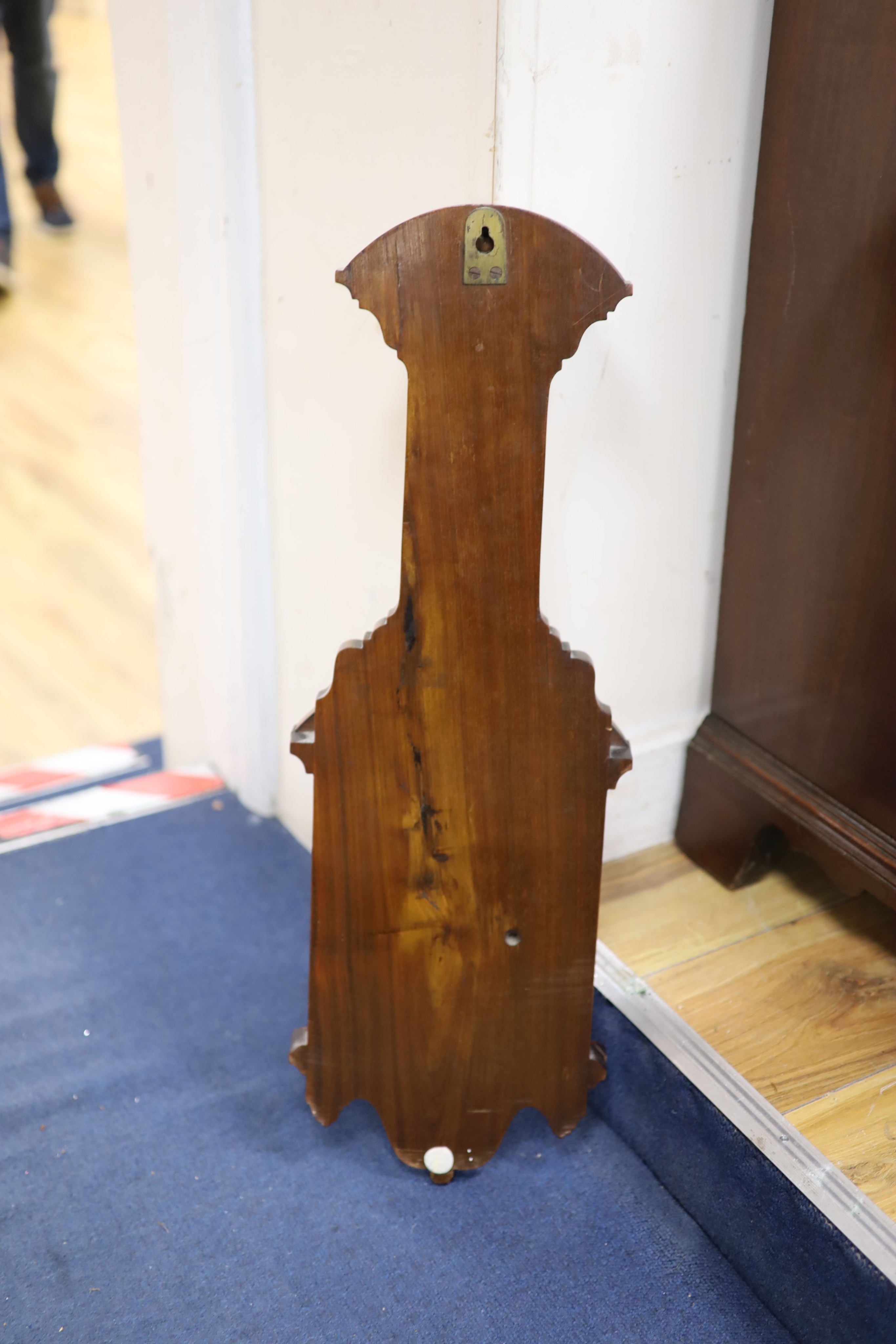 J Brown, Glasgow, a late Victorian carved walnut cased aneroid barometer and thermometer, height 65cm